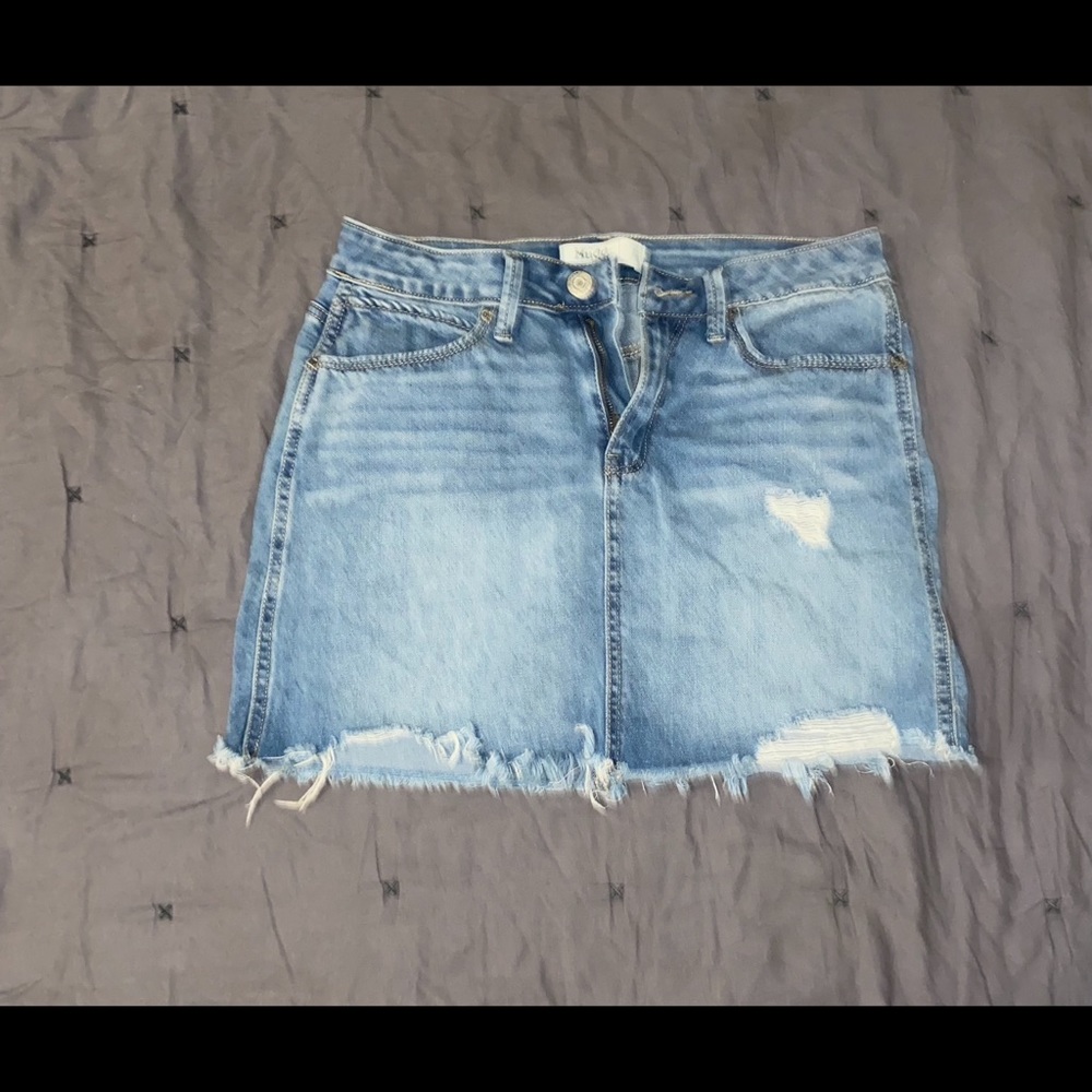 Ripped blue jean mini skirt